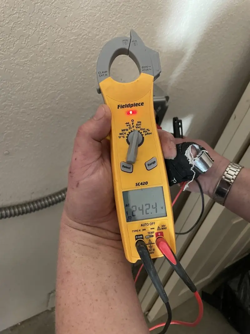 Voltage testing with clamp meter during Ceiling Fan Installation in Coal City